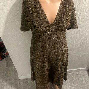 A gold sparkling dress